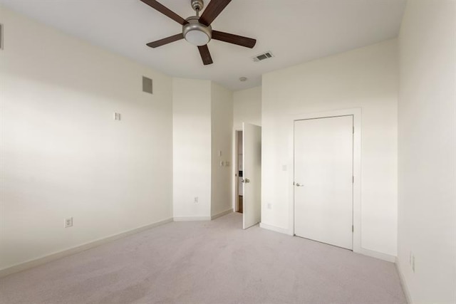 870 Inman Village Pkwy Unit 203, Atlanta, GA 30307 - unfurnished bedroom with light carpet and a ceiling fan