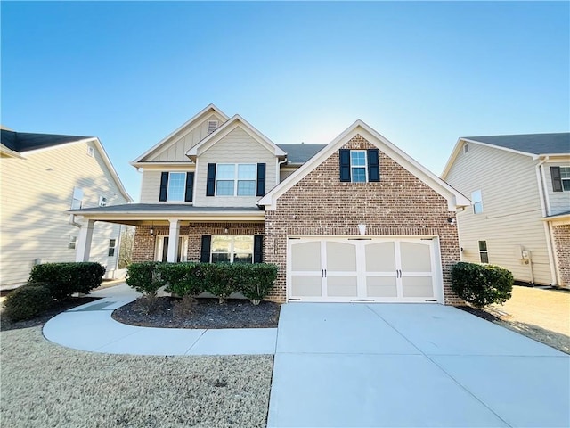 view of front of house with concrete driveway, an attached garage, covered porch, board and batten siding, and brick siding