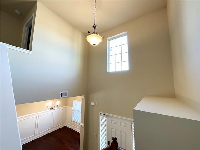 entryway featuring dark wood-style floors and visible vents