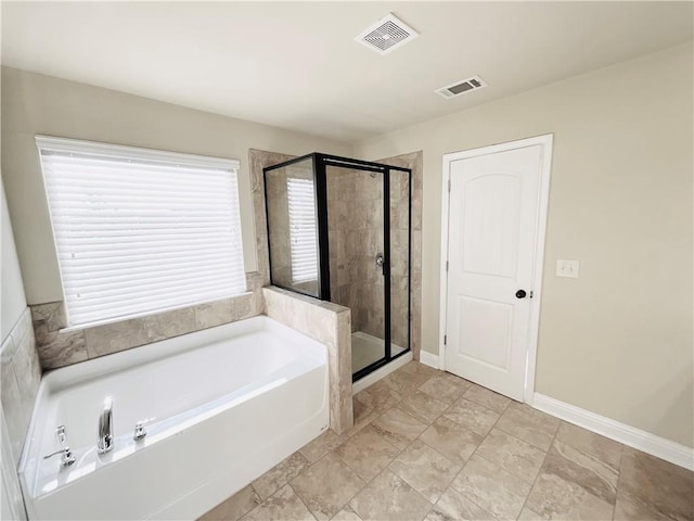 full bath with baseboards, a shower stall, visible vents, and a bath