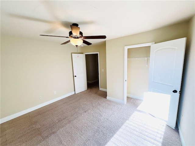 unfurnished bedroom with light carpet, ceiling fan, baseboards, and a closet