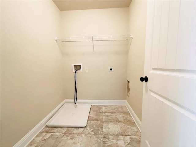 clothes washing area featuring laundry area, washer hookup, electric dryer hookup, and baseboards