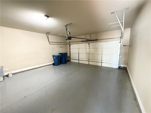 garage featuring baseboards and a garage door opener