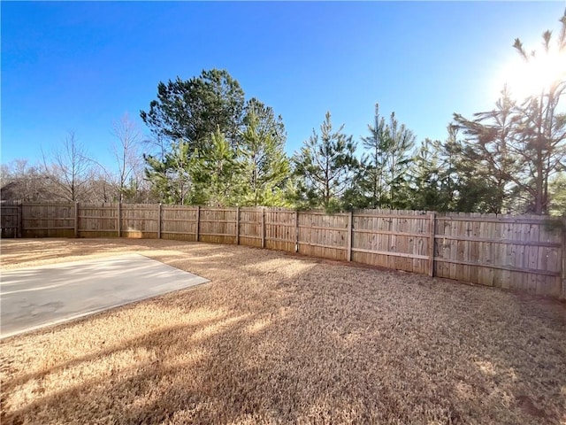 view of yard with a fenced backyard