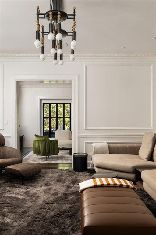 31 Lafayette Dr NE, Atlanta, GA 30309 - living area featuring a chandelier, ornamental molding, and a decorative wall