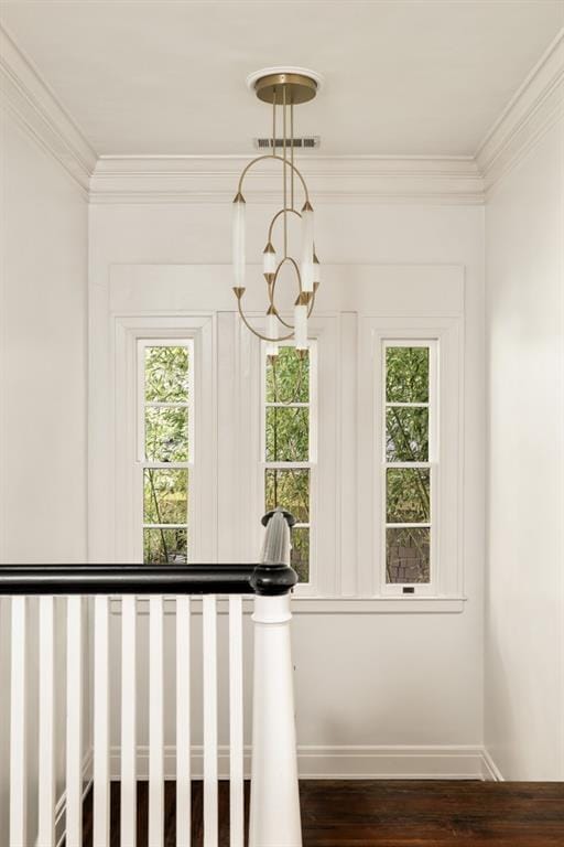 31 Lafayette Dr NE, Atlanta, GA 30309 - staircase with crown molding, wood finished floors, a chandelier, healthy amount of natural light, and baseboards