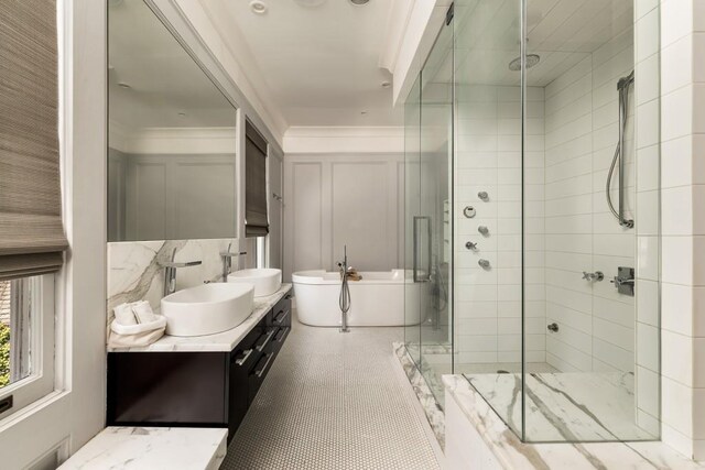 31 Lafayette Dr NE, Atlanta, GA 30309 - full bath featuring double vanity, a shower stall, a freestanding bath, and ornamental molding
