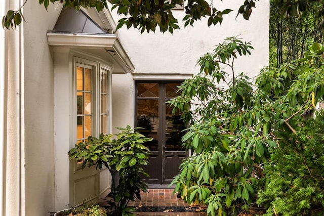 31 Lafayette Dr NE, Atlanta, GA 30309 - view of exterior entry featuring stucco siding and french doors