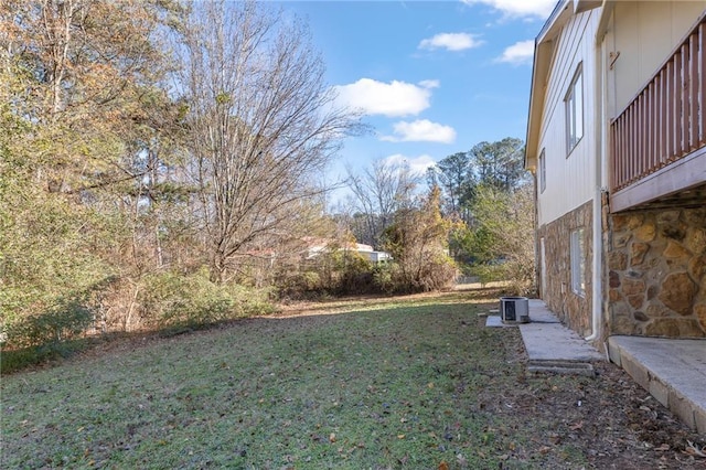 view of yard with central AC