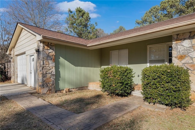 view of exterior entry featuring a garage