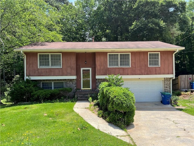2065 Sandgate Cir, Atlanta, GA 30349 - raised ranch featuring driveway, an attached garage, and board and batten siding