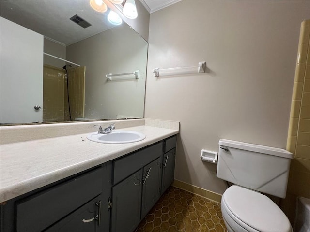 2065 Sandgate Cir, Atlanta, GA 30349 - full bathroom featuring vanity, toilet, baseboards, and a shower