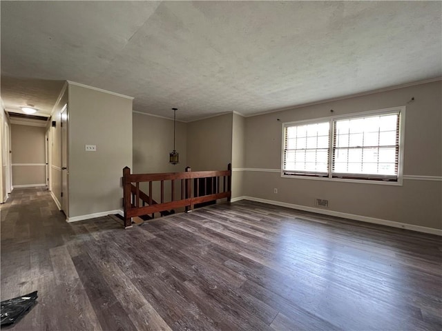 2065 Sandgate Cir, Atlanta, GA 30349 - empty room featuring ornamental molding, dark wood-type flooring, and baseboards