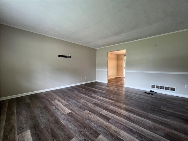 2065 Sandgate Cir, Atlanta, GA 30349 - spare room featuring dark wood finished floors, baseboards, and crown molding
