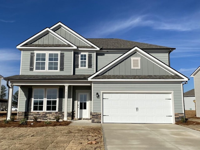 craftsman house with a porch and a garage