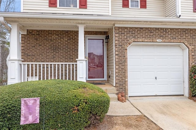 doorway to property featuring a garage