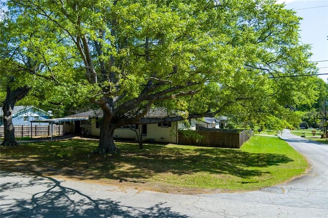 4699 Ballew Dr, Powder Springs, GA 30127 - view of home's exterior with a yard and fence