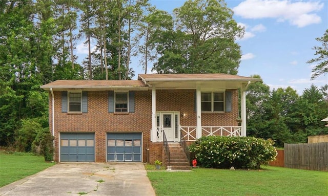 115 Elizabeth Way, Ellenwood, GA 30294 - raised ranch featuring an attached garage, concrete driveway, and brick siding