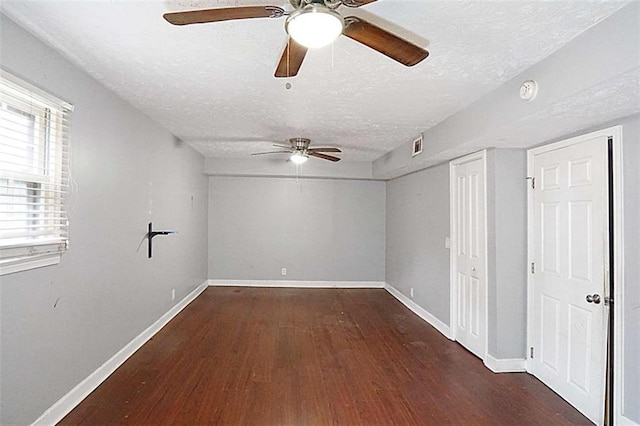 115 Elizabeth Way, Ellenwood, GA 30294 - empty room with a textured ceiling, a ceiling fan, wood finished floors, and a smoke detector