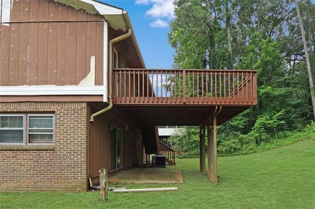 115 Elizabeth Way, Ellenwood, GA 30294 - back of house featuring a deck, a lawn, brick siding, stairs, and a patio area