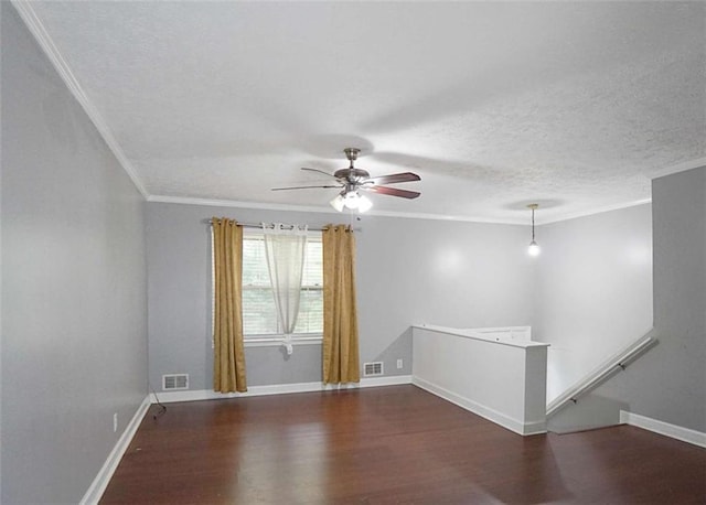 115 Elizabeth Way, Ellenwood, GA 30294 - unfurnished room featuring wood finished floors, ornamental molding, a ceiling fan, and a textured ceiling