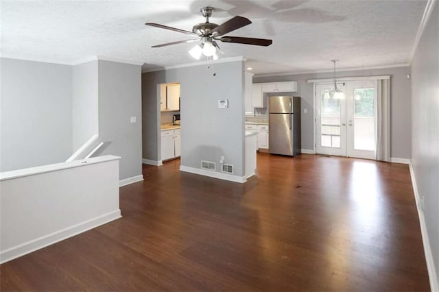 115 Elizabeth Way, Ellenwood, GA 30294 - unfurnished living room with crown molding, dark wood-style flooring, a textured ceiling, a ceiling fan, and french doors