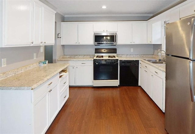 115 Elizabeth Way, Ellenwood, GA 30294 - kitchen with appliances with stainless steel finishes, dark wood-style flooring, light countertops, ornamental molding, and white cabinets
