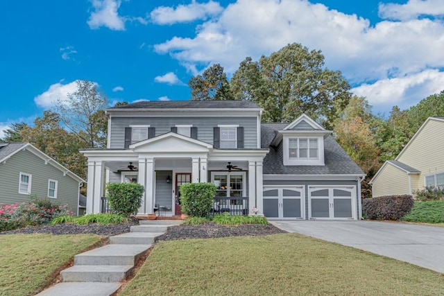 view of front facade with a porch, a garage, and a front lawn