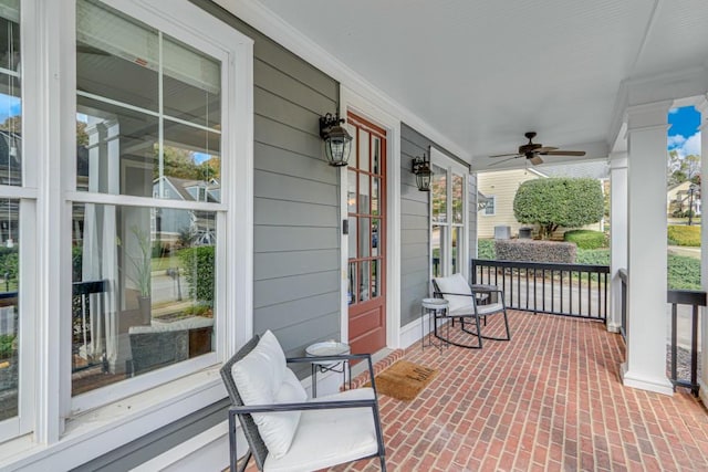 view of patio featuring ceiling fan and a porch