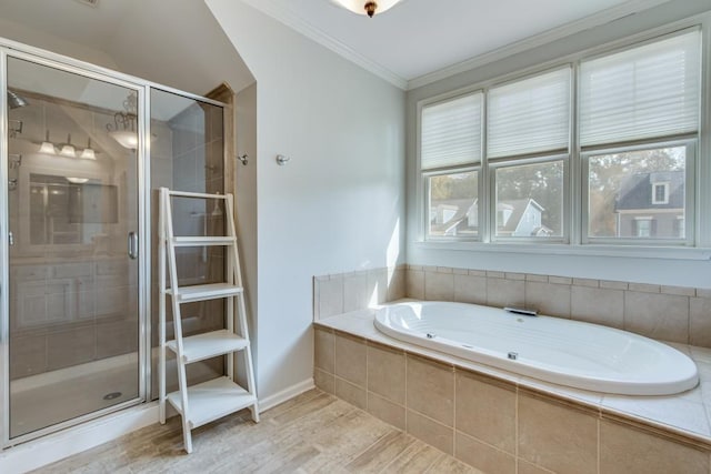 bathroom with crown molding, separate shower and tub, and hardwood / wood-style flooring