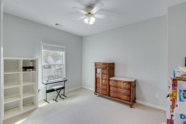 misc room with light carpet and ceiling fan