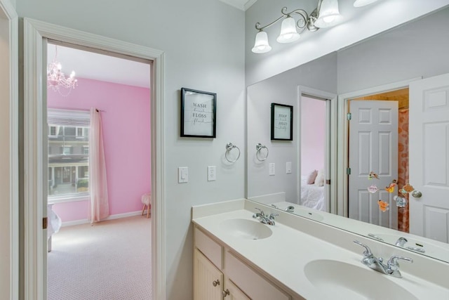 bathroom featuring vanity and a notable chandelier