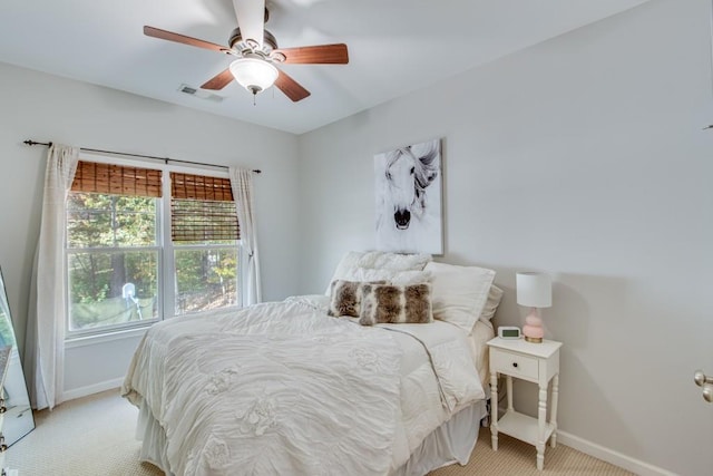 carpeted bedroom featuring ceiling fan