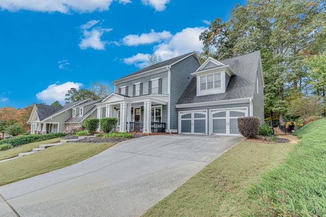 view of front facade with a garage, a front lawn, and a porch