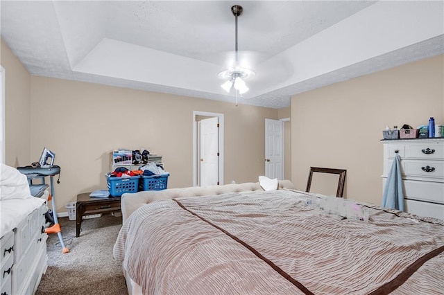 1574 Glenfield Dr, Lawrenceville, GA 30043 - bedroom featuring carpet floors, a raised ceiling, and baseboards