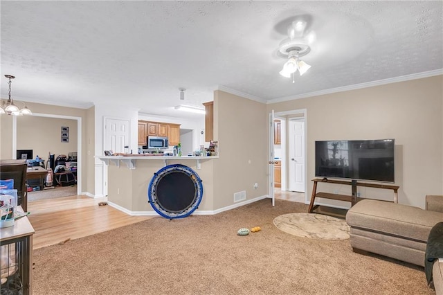 1574 Glenfield Dr, Lawrenceville, GA 30043 - living room with light colored carpet, a textured ceiling, ceiling fan, baseboards, and ornamental molding