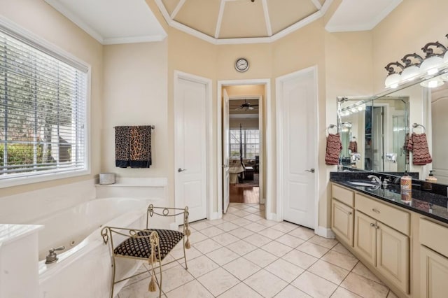 bathroom featuring a ceiling fan, a jetted tub, tile patterned flooring, crown molding, and vanity