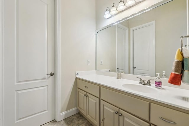 bathroom featuring vanity and baseboards