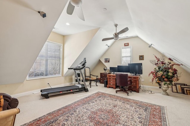 office with baseboards, a ceiling fan, vaulted ceiling, and carpet flooring