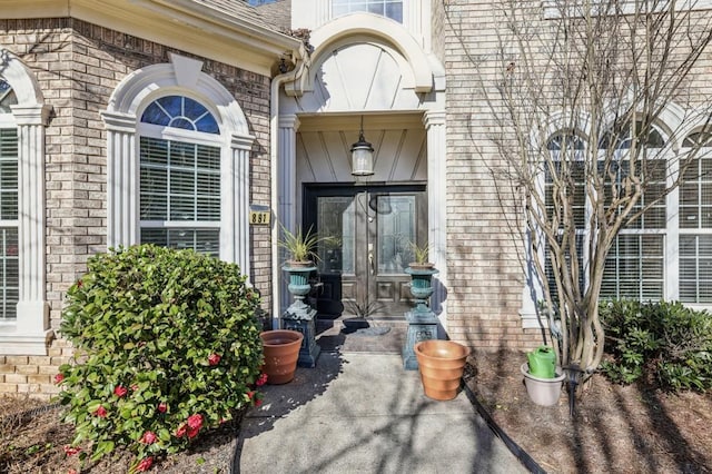 property entrance with brick siding