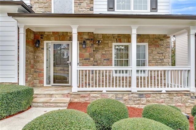 doorway to property with covered porch