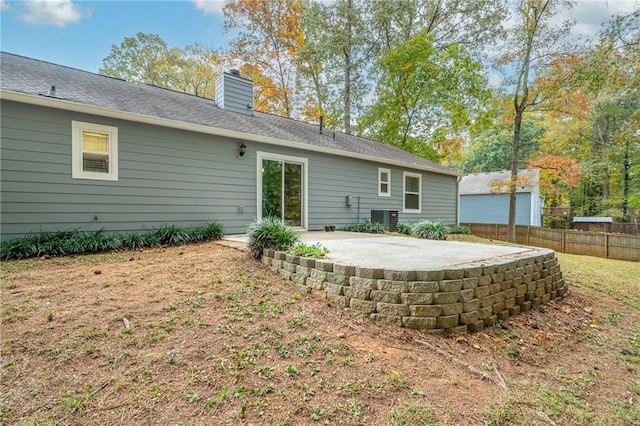 back of house featuring central AC and a patio