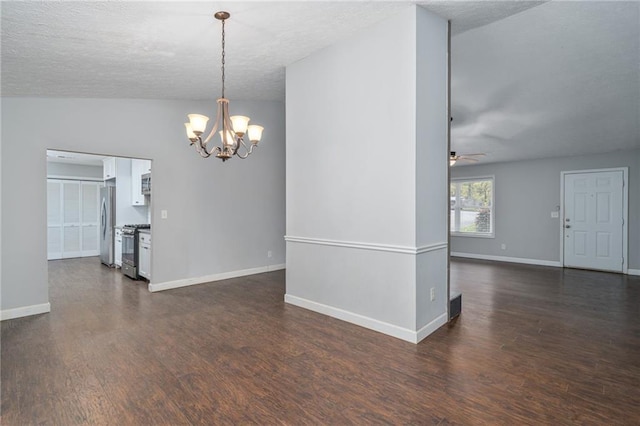 empty room with lofted ceiling, a textured ceiling, ceiling fan with notable chandelier, and dark hardwood / wood-style flooring