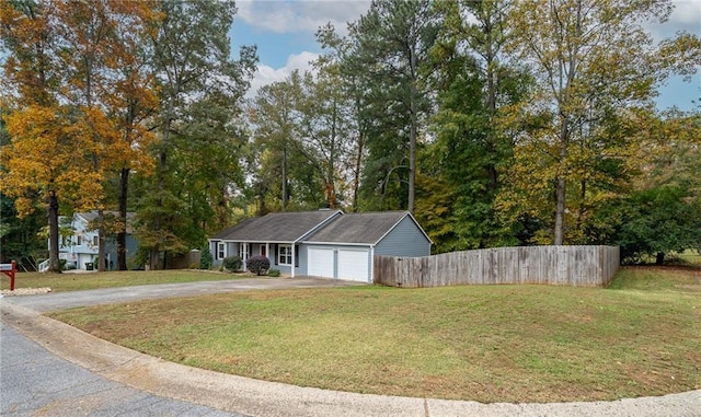 exterior space with a front yard and a garage