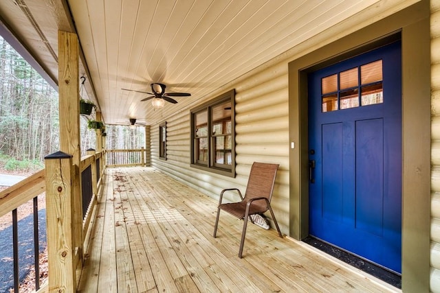 wooden deck with ceiling fan and a porch