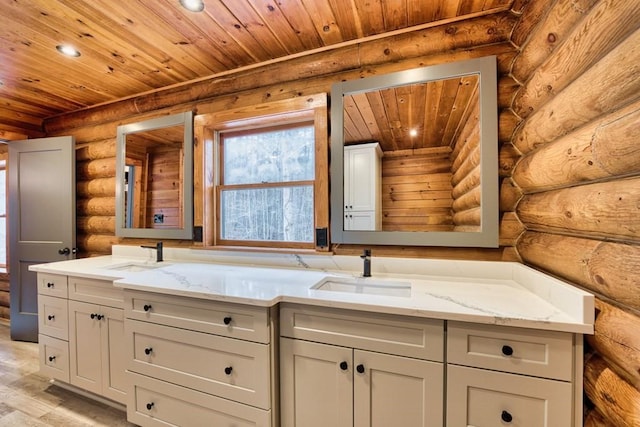 kitchen with light stone countertops, wooden ceiling, and a sink