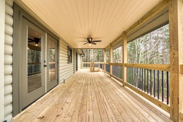 deck featuring a ceiling fan and french doors