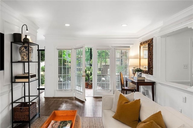 doorway to outside with dark hardwood / wood-style flooring and ornamental molding