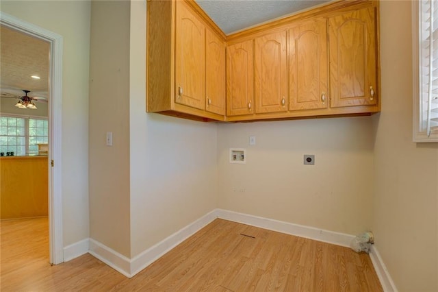 172 Lakeview Dr, Newborn, GA 30056 - laundry area with washer hookup, hookup for an electric dryer, light wood finished floors, a ceiling fan, and cabinet space