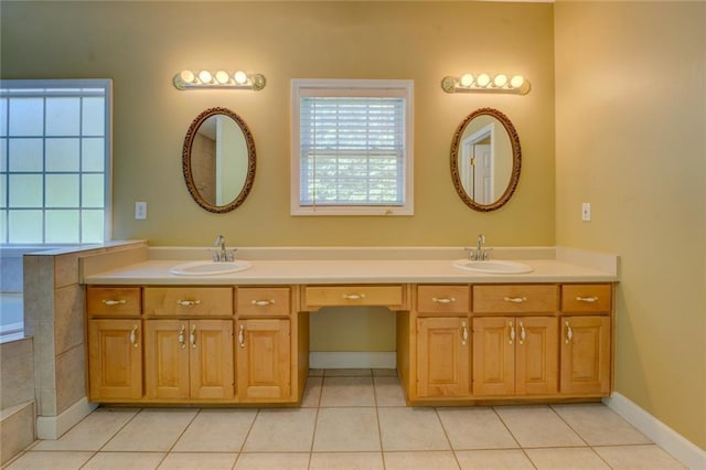 172 Lakeview Dr, Newborn, GA 30056 - full bath featuring double vanity, tile patterned flooring, and a tub to relax in
